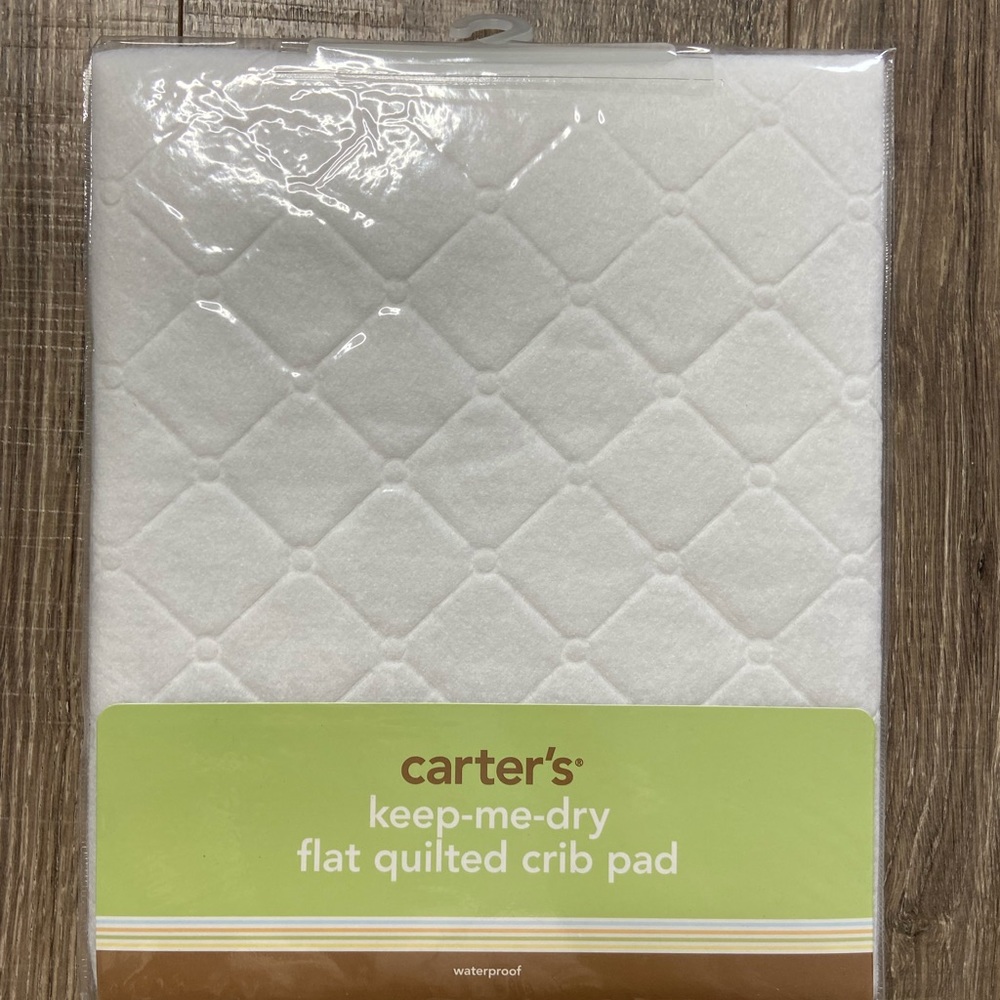 Carter’s Keep-Me-Dry flat quilter crib pad